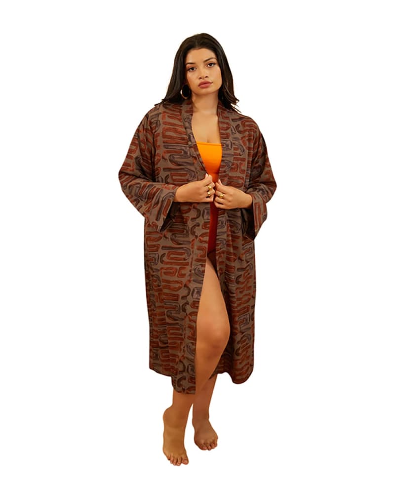 Front of a model wearing a size 2X Giada Tribal Print Duster in Brown by Rebdolls. | dia_product_style_image_id:328527